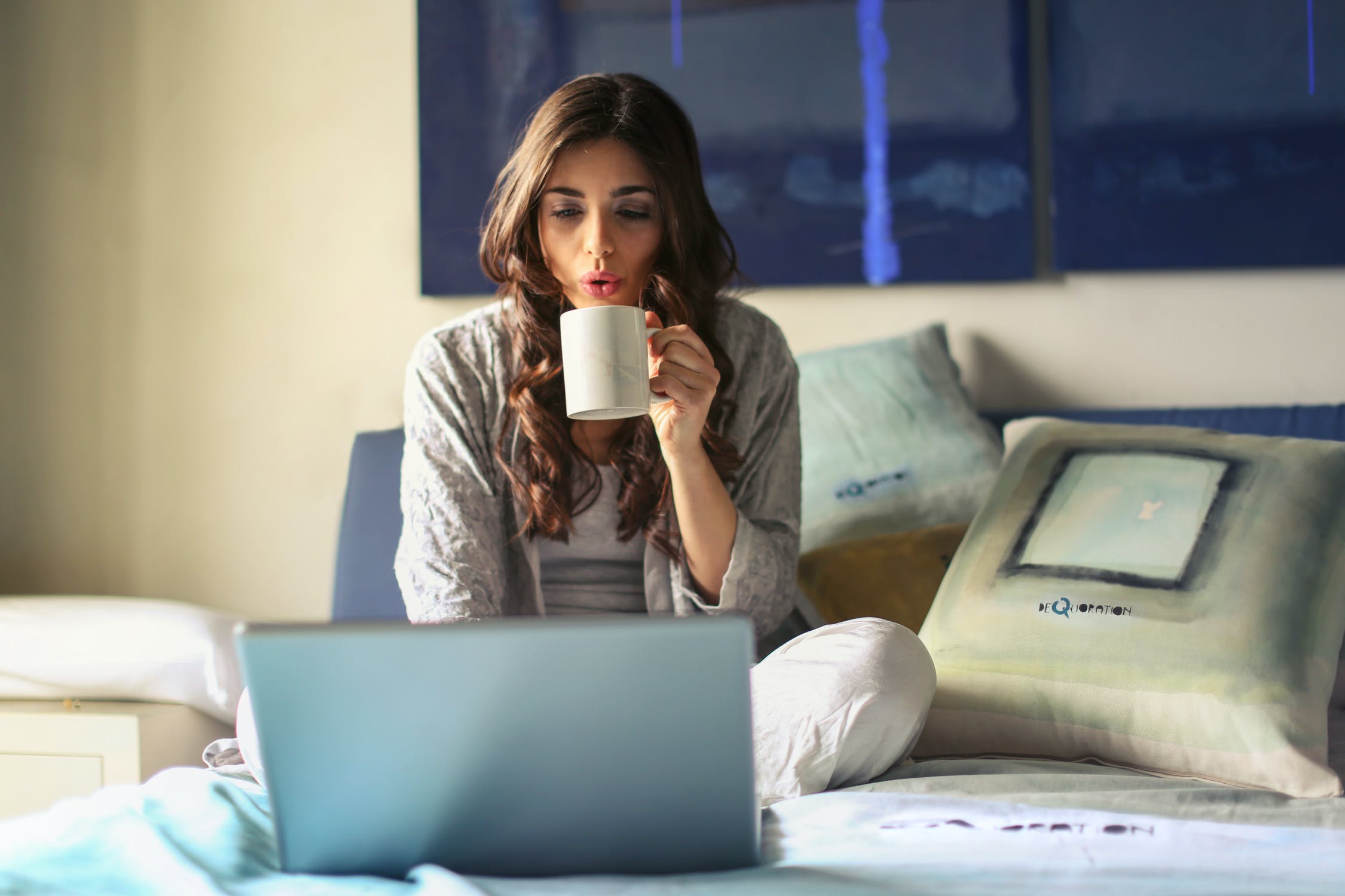 Lady Drinking Tea On Laptop