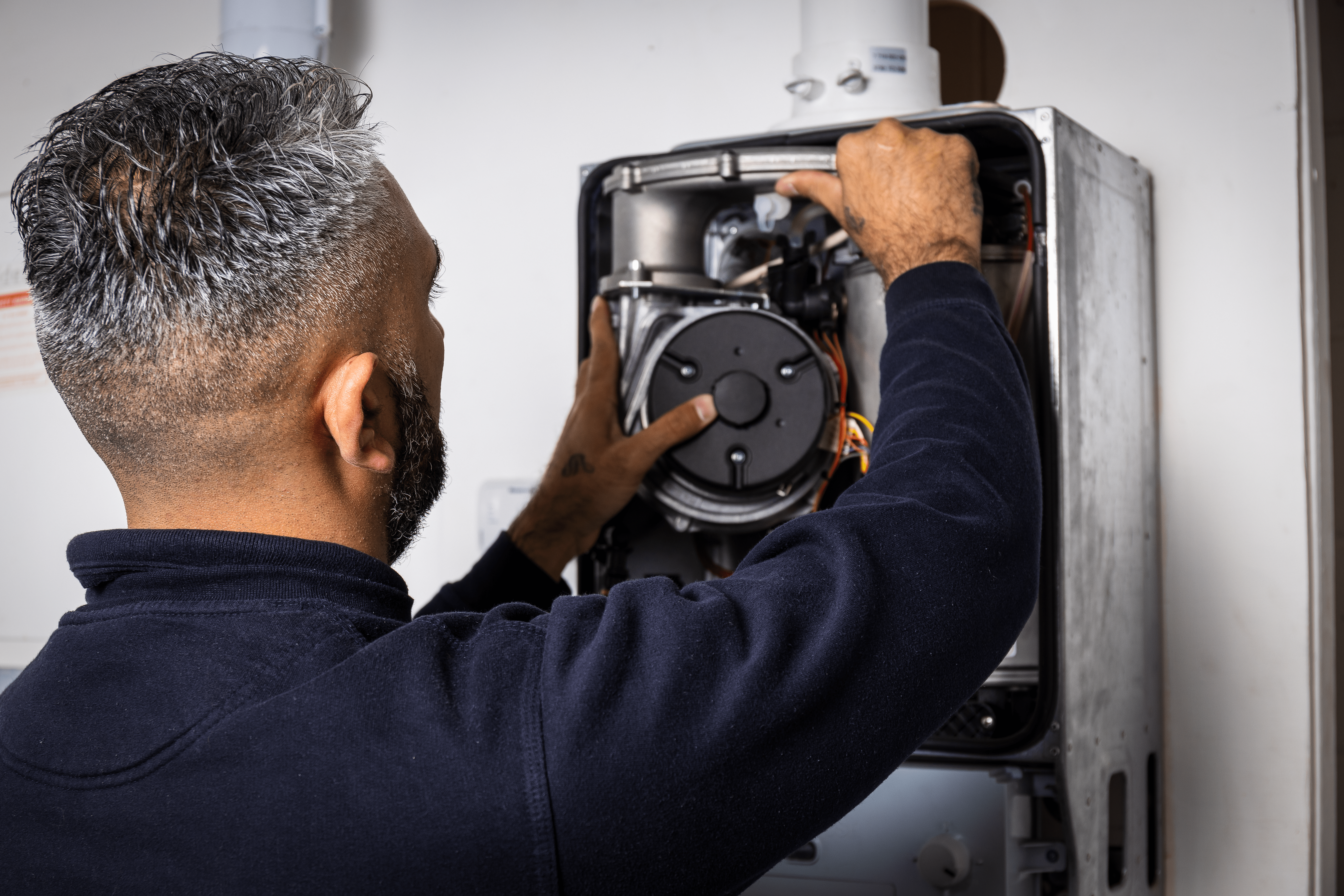 A Boiler Repair Technician Fixing A Boiler (1)